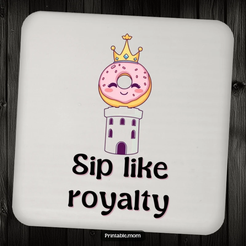 Funny drink coaster showing a smiling donut wearing a small crown, balanced on top of a tower.