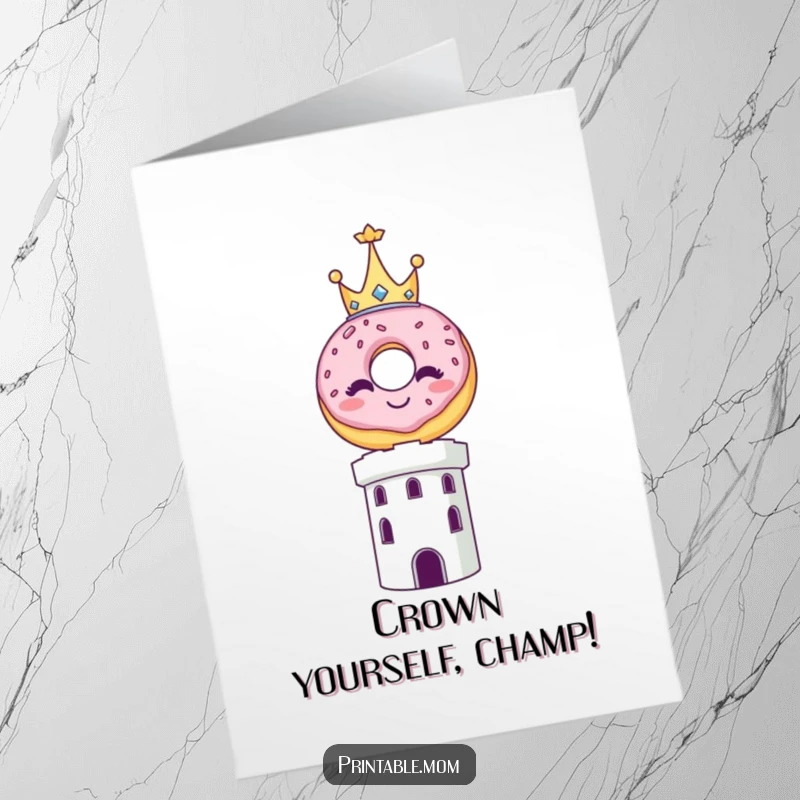 Funny Free Printable Congratulations Card: A smiling donut wearing a tiny crown proudly balances on a tower, celebrating a grand achievement.