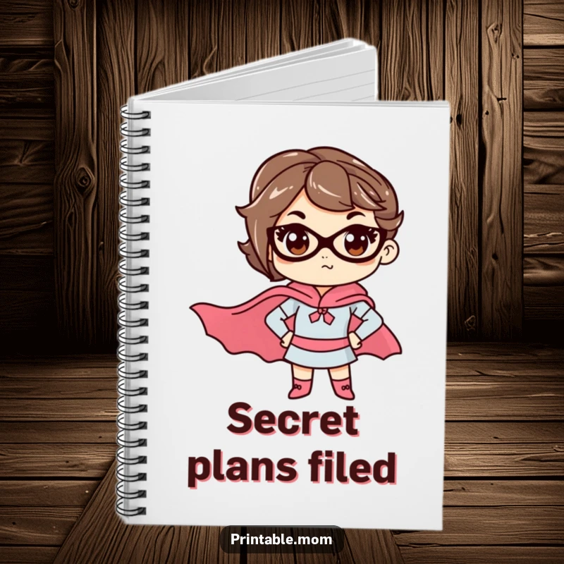 Funny mom notebook with a determined mom wearing a superhero cape, great for planning missions or daily tasks.