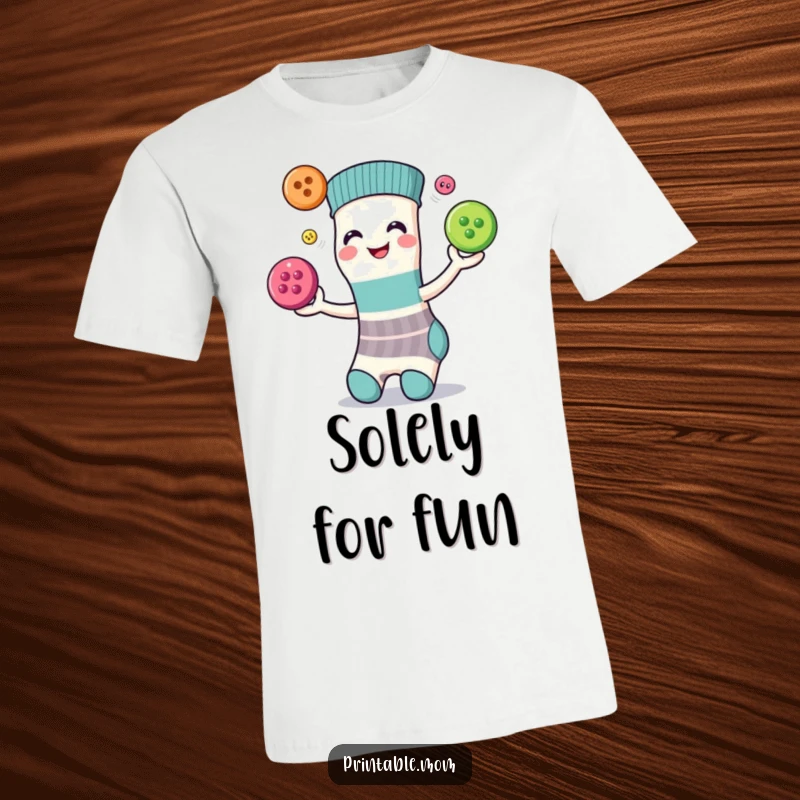Funny T-shirt depicting a smiling sock with a face, expertly juggling three colorful buttons with a cheerful expression.