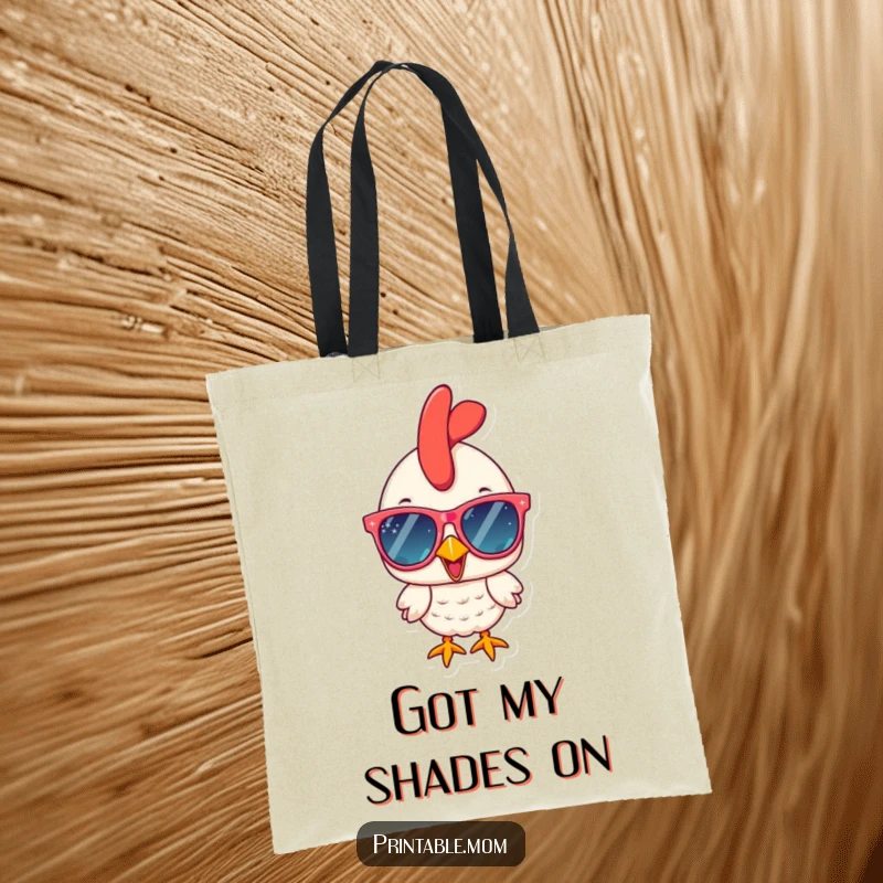 Funny chicken with oversized sparkly sunglasses, cheerfully carrying essentials in a durable and funny tote bag